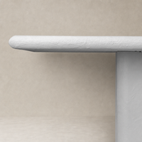 Selby Dining Table in plaster molded concrete with a smooth, rounded edge design.