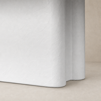 Plaster molded concrete Selby dining table with a smooth, modern finish.