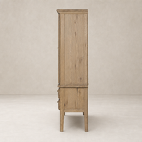 Lagos Cabinet in worn oak showcasing a tall, sleek design with natural wood grain.