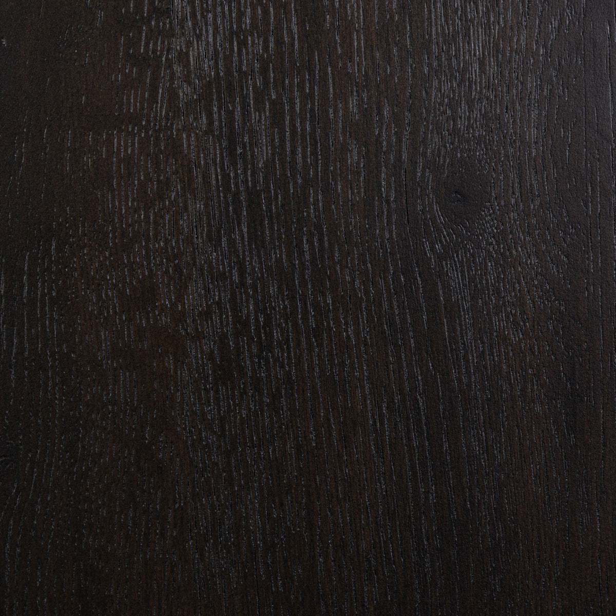 Close-up of the smoked black finish on the Lagos Cabinet, showcasing rich wood texture.