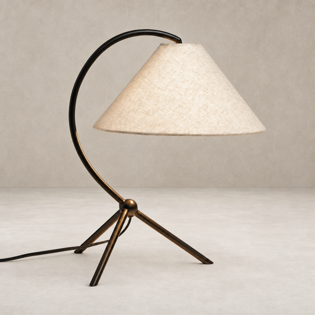 Matte black table lamp with a curved design and a conical beige shade.