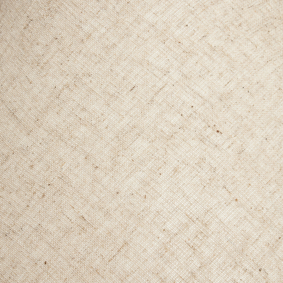 Close-up of textured linen fabric in a neutral cream color.