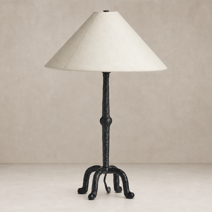 Matte black cast aluminum table lamp with a textured stem and conical shade.