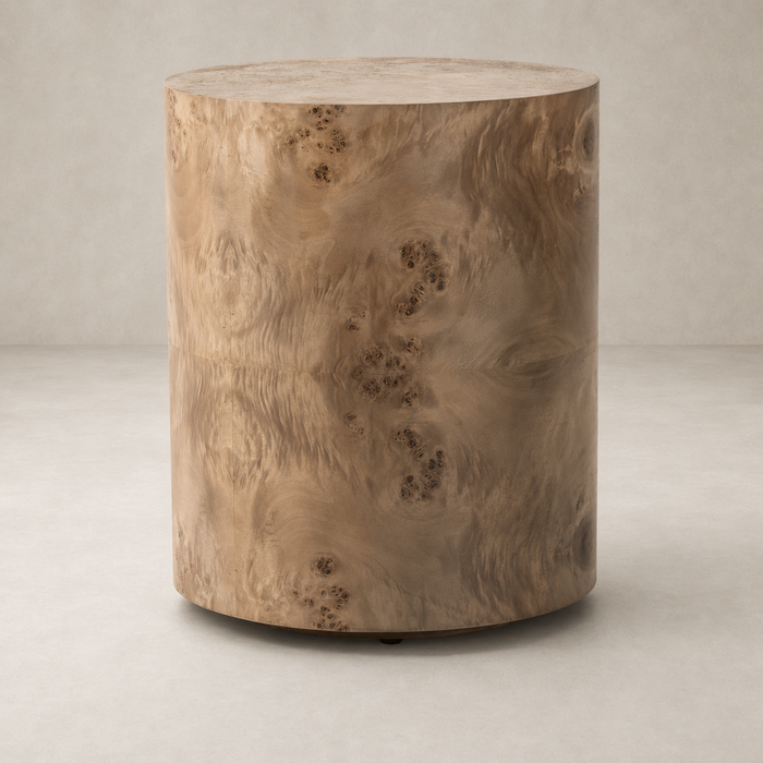 Zuri End Table featuring a smooth, cylindrical design with a natural wood finish.