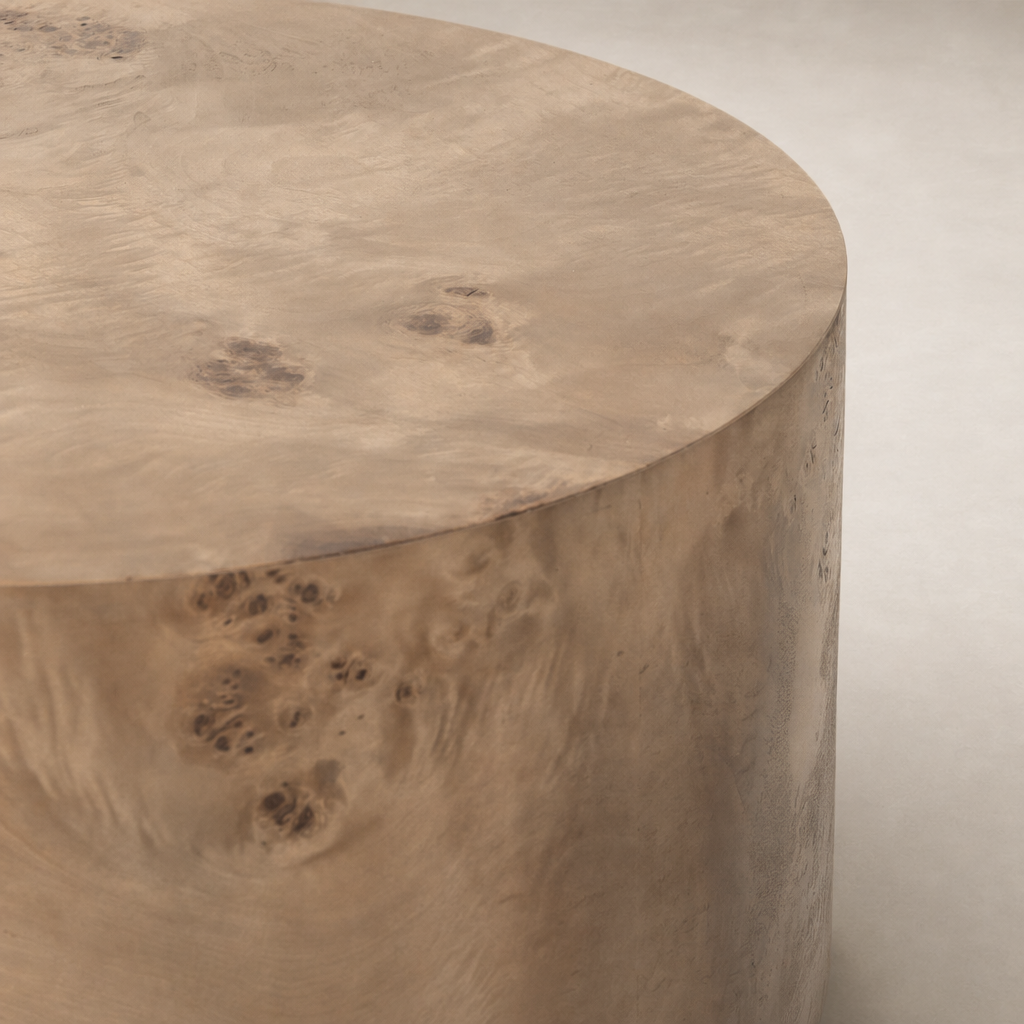 Zuri End Table featuring a smooth, rounded surface with natural wood grain patterns.