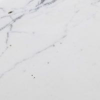Close-up of the marble surface of the Esme End Table showing white with gray veining.