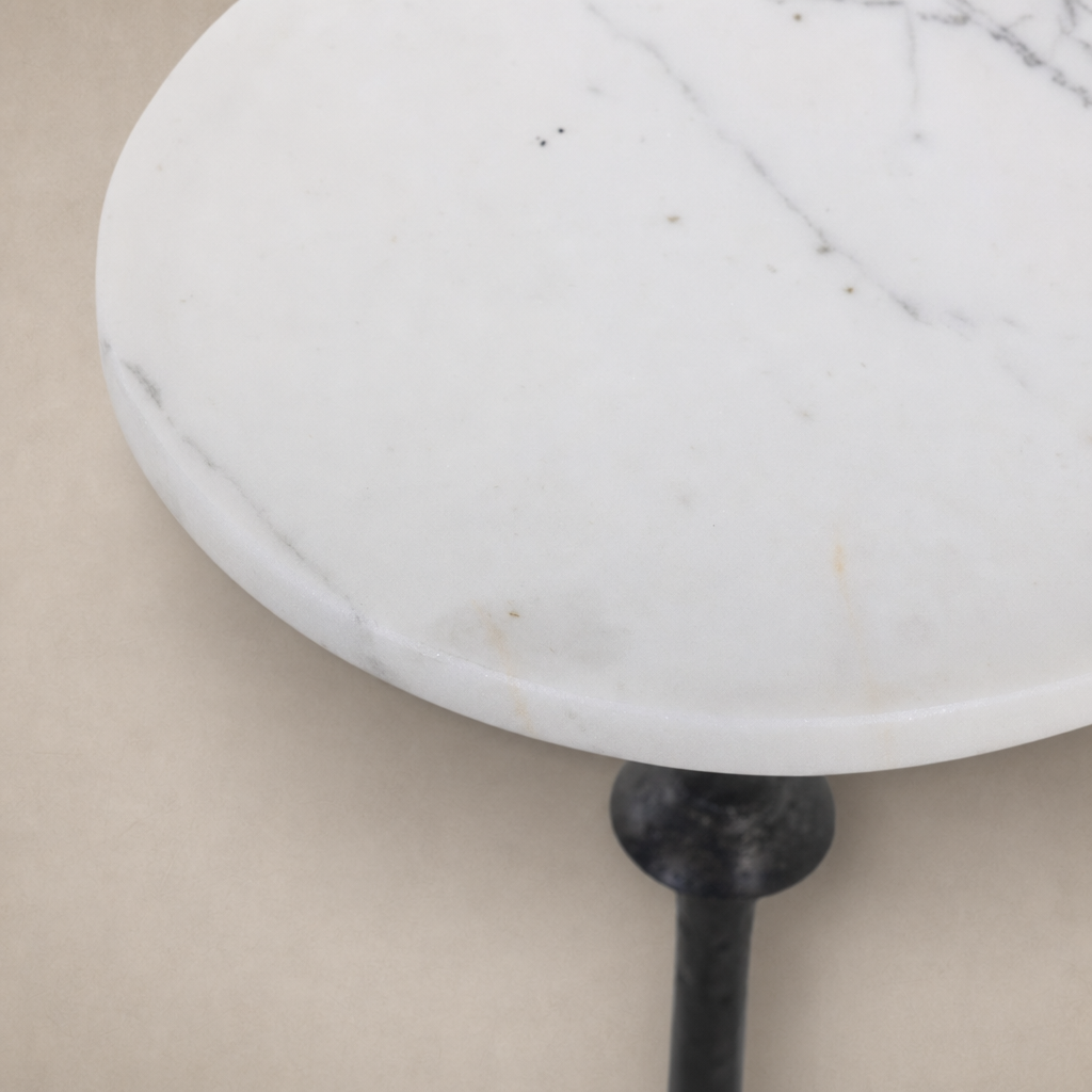 Esme End Table with a sleek round white marble top and sturdy metal base.