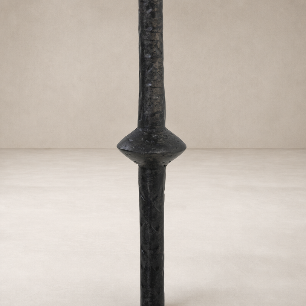 Esme End Table featuring a textured black pillar design with unique shape and details.