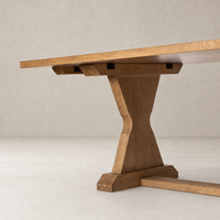 Lucia Extension Dining Table in worn oak, showcasing a sturdy, angled base and smooth finish.