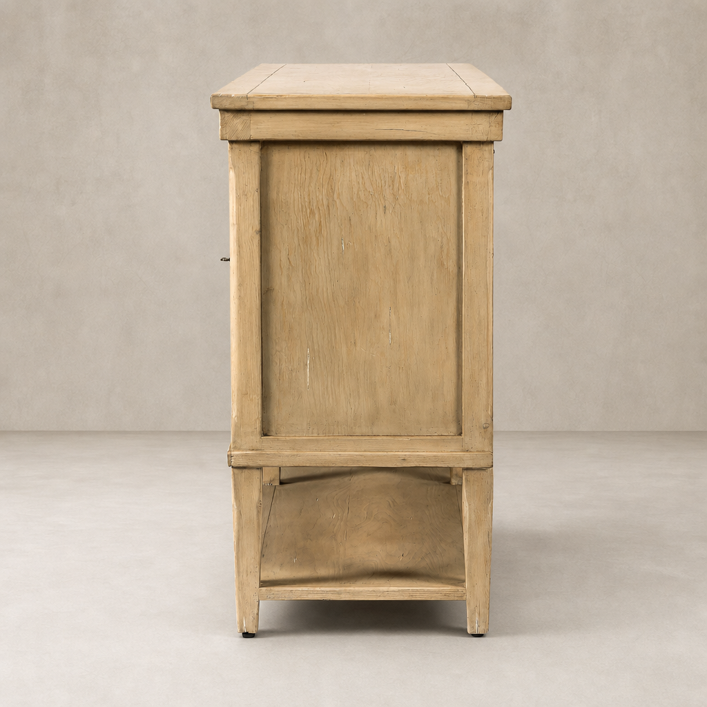 Side view of the Henley Sideboard in aged light pine showcasing its natural wood grain and simple design.