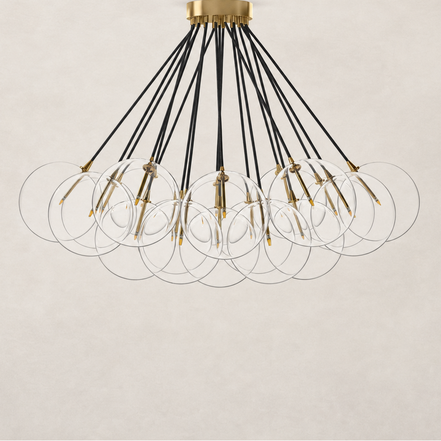 Burnished brass chandelier with multiple clear glass orbs and black cords.