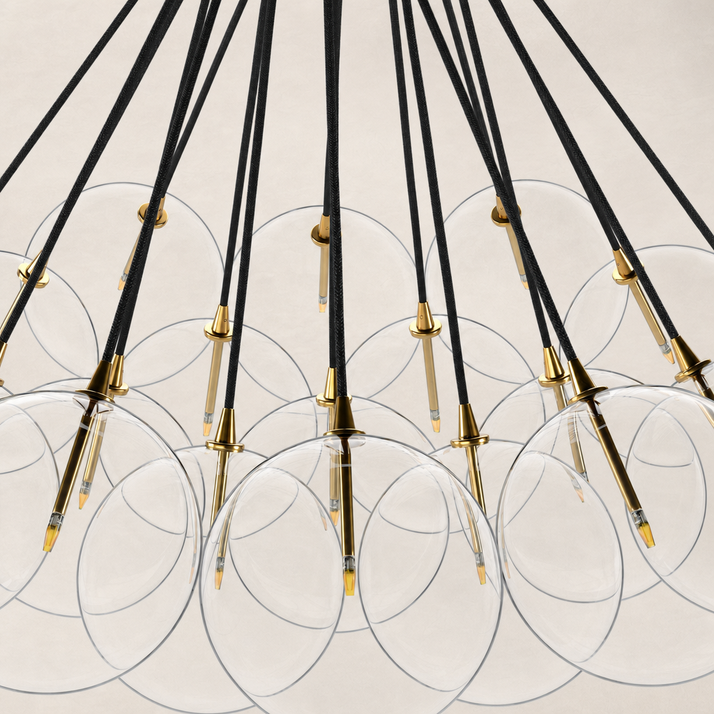 Burnished brass chandelier with clear glass globes and black wiring.