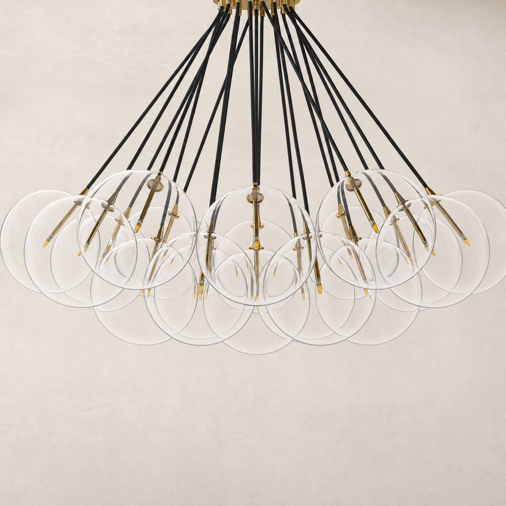 Burnished brass chandelier with clear circular shades and black cords.