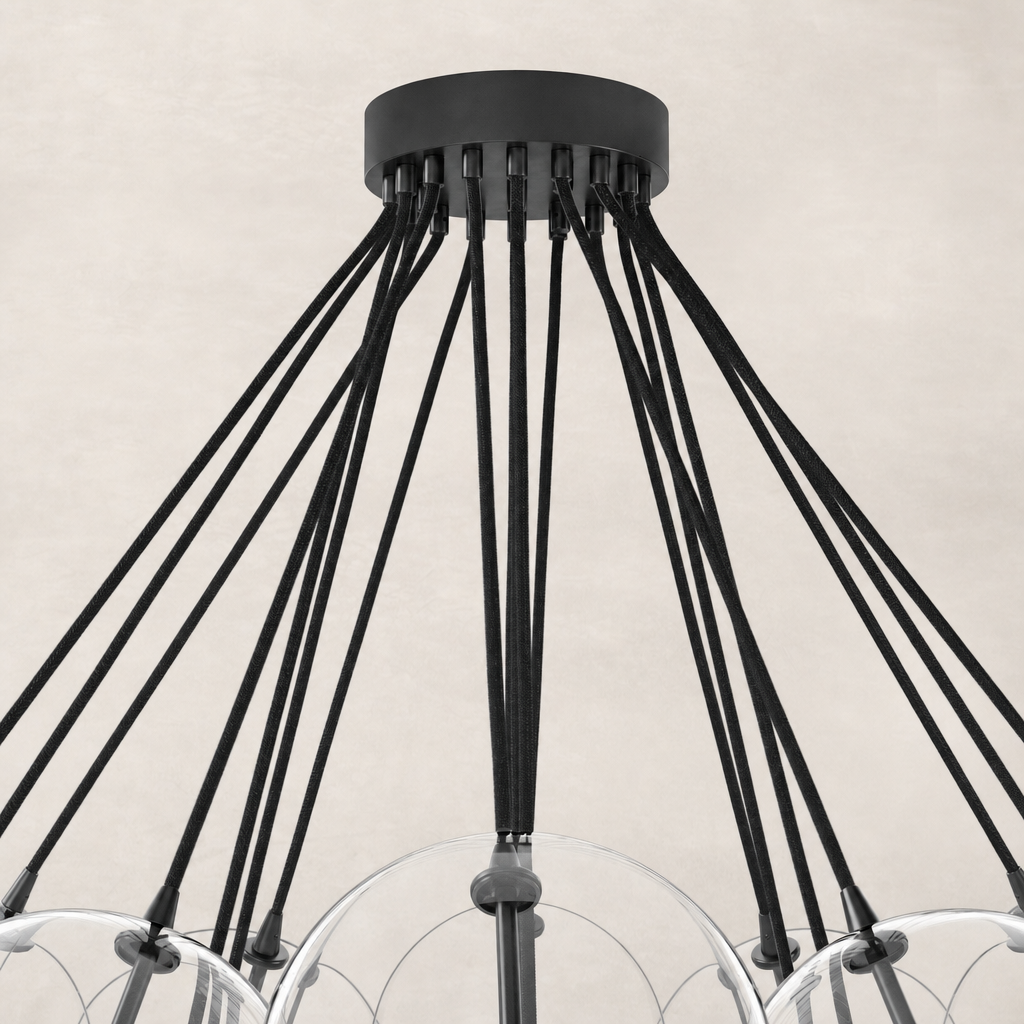 Black gunmetal chandelier showcasing sleek, stylish design with multiple hanging cords.