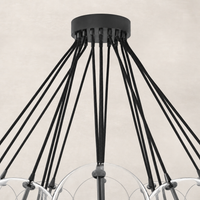 Black gunmetal chandelier showcasing sleek, stylish design with multiple hanging cords.