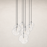 Black gunmetal 7 Mix chandelier featuring glass bubble shades, perfect for modern decor.