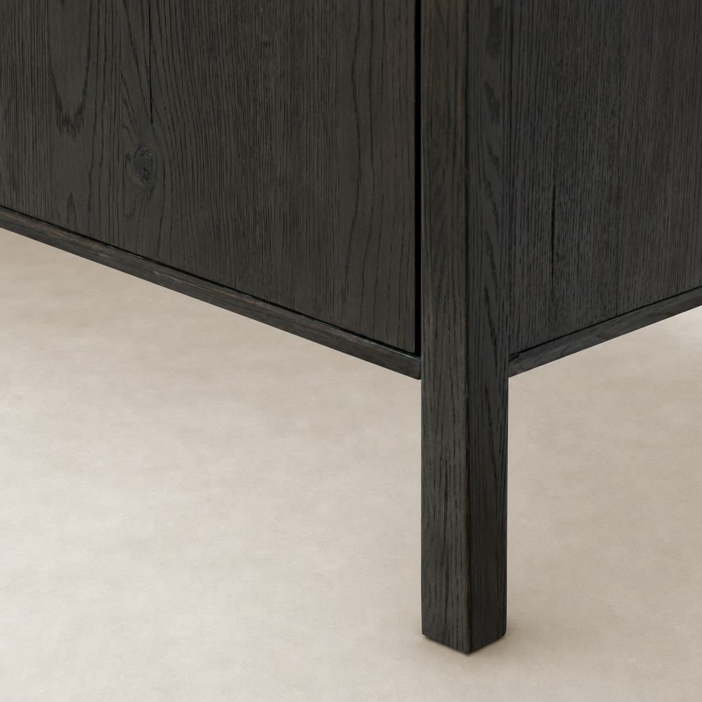 Zuma Wide Bookshelf in Smoked Black Oak, showcasing rich texture and sturdy leg design.