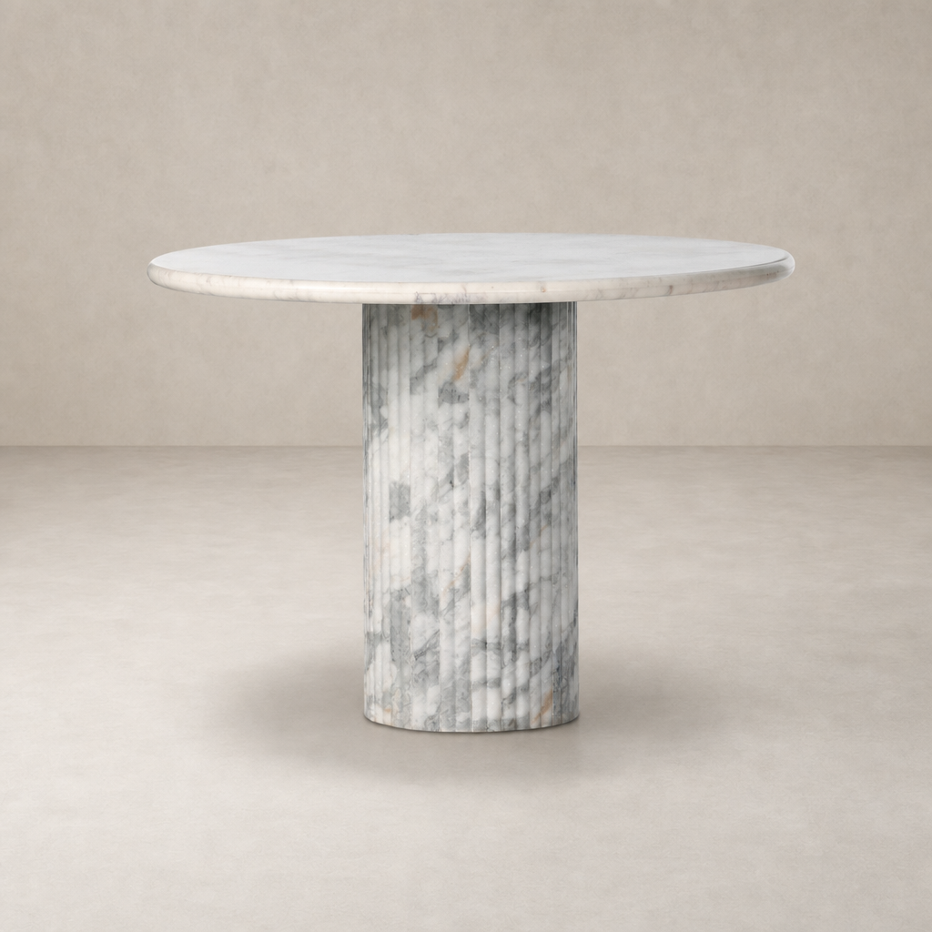 Ilaria Round Dining Table 42 in polished white marble with a textured cylindrical base.