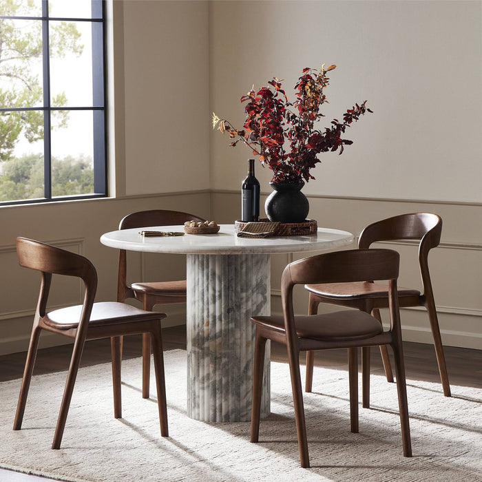 Ilaria Round Dining Table 42 in polished white marble with elegant wooden chairs.