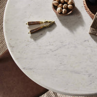 Ilaria Round Dining Table 42 with polished white marble surface and elegant design.