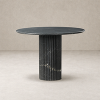 Ilaria Round Dining Table 42 features a sleek black marble top and ribbed pedestal base.