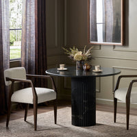 Ilaria Round Dining Table 42 in elegant black marble with a sleek pedestal base.