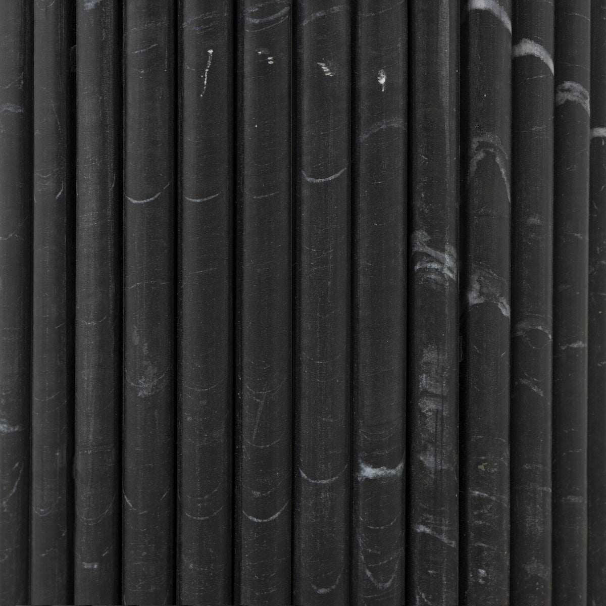 Close-up of the black marble finish on the Ilaria Round Dining Table 42.