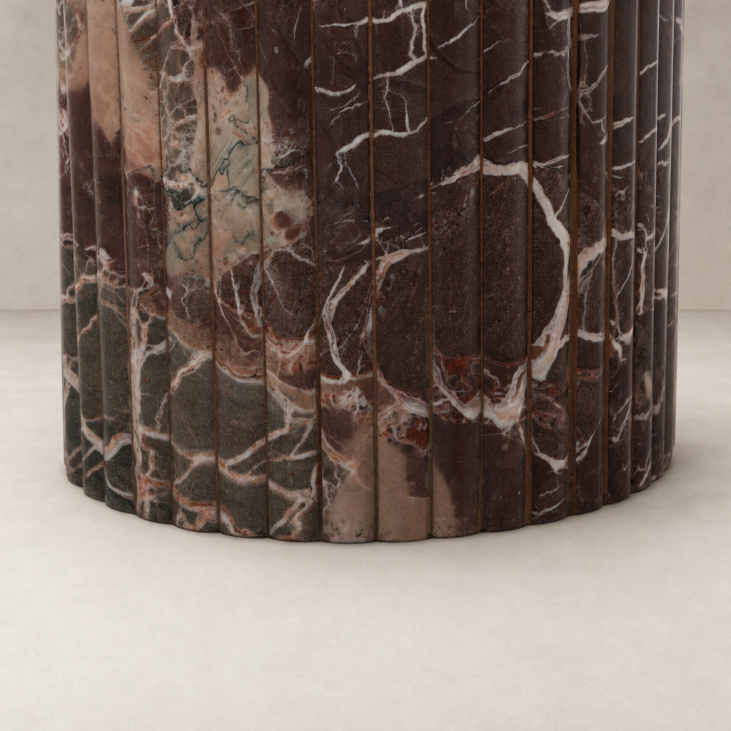 Close-up of Ilaria Round Dining Table 42 in Merlot Marble, highlighting its textured, polished finish.