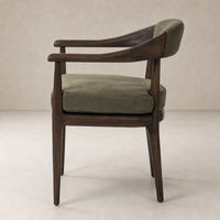 Nolan Dining Chair in Broadway Olive with sleek wood arms and plush cushion.