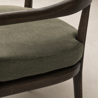 Nolan Dining Chair in Broadway Olive with soft cushion and wooden frame.