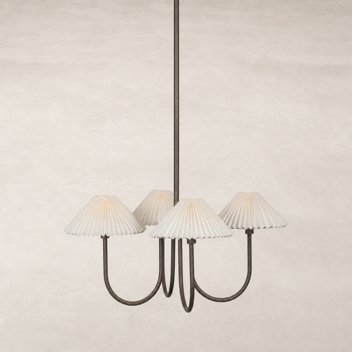 Light oil rubbed bronze chandelier with four pleated white shades.