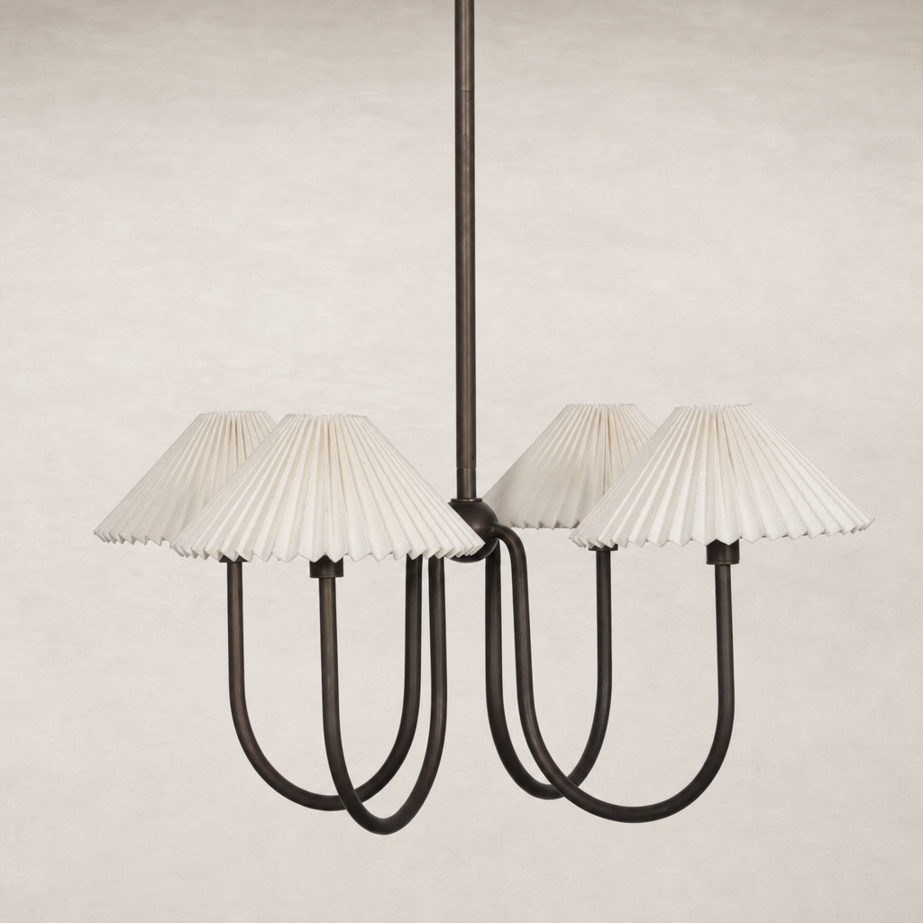 Light oil rubbed bronze chandelier with pleated cream lamp shades.