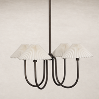 Light oil rubbed bronze chandelier with pleated cream lamp shades.
