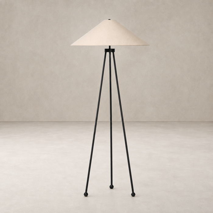Matte black floor lamp with a conical shade and tripod legs for modern decor.