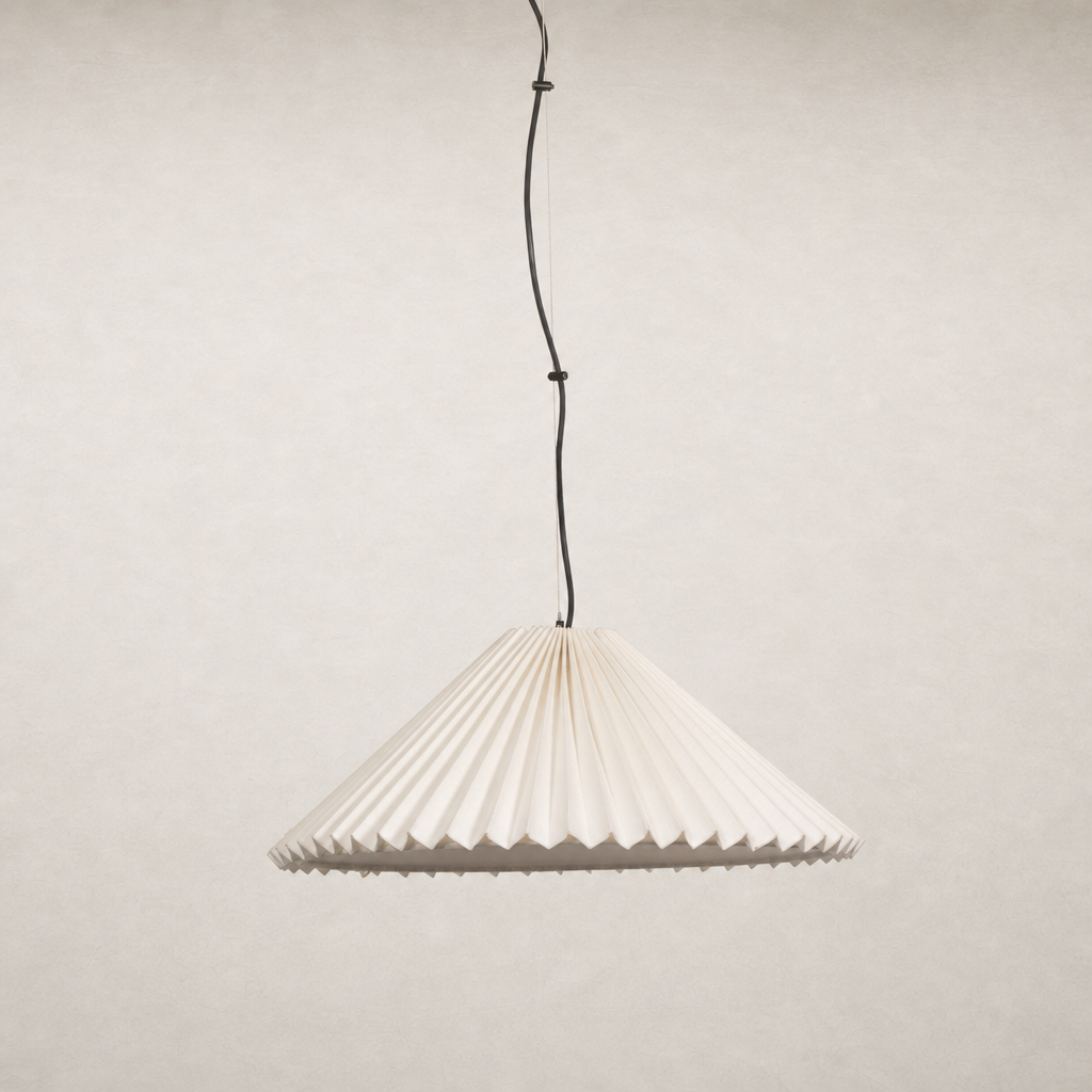 Jet black pendant light with pleated design hanging from a black cord.