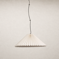 Jet black pendant light with pleated design hanging from a black cord.