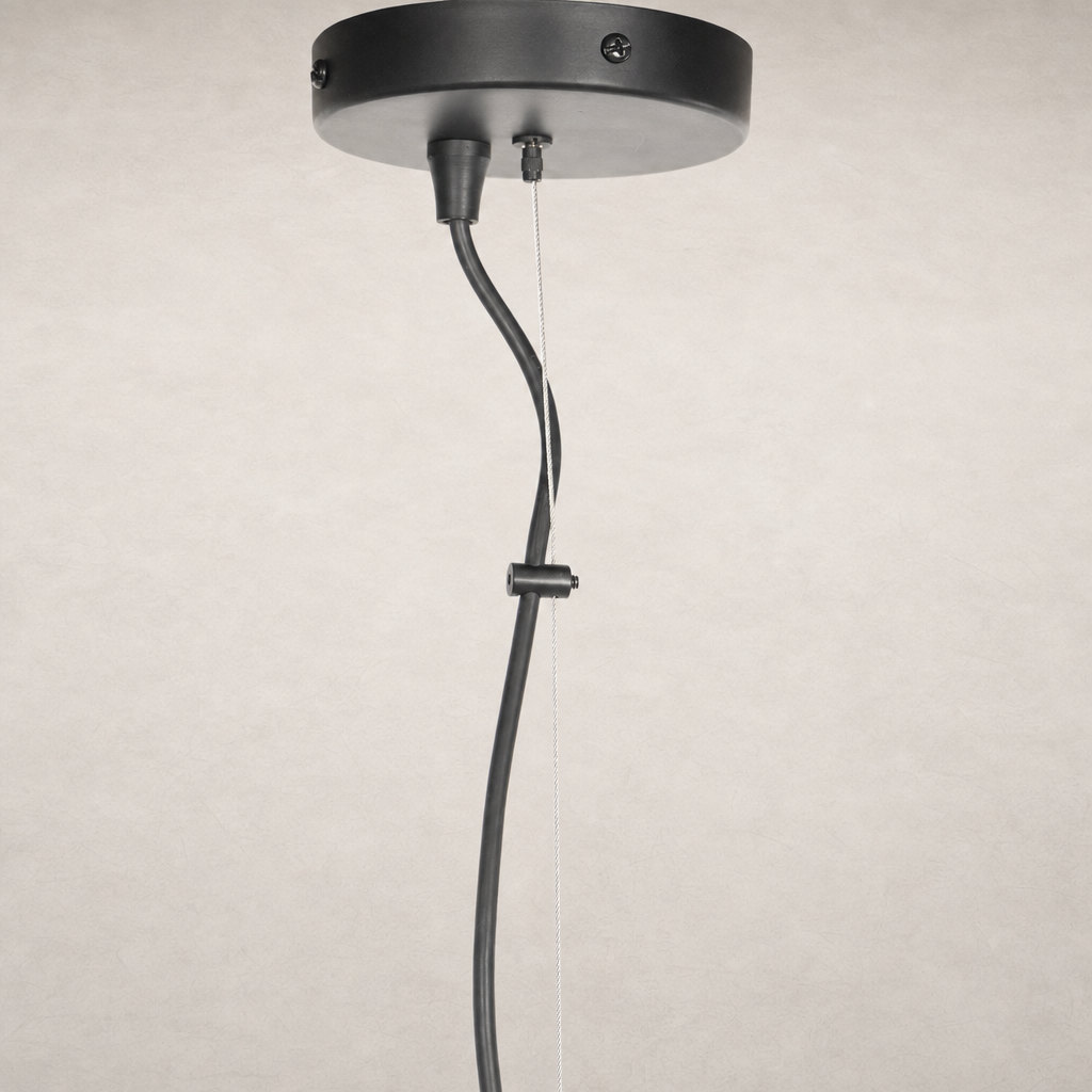 Jet black pendant light with sleek, minimalist design and hanging cord.