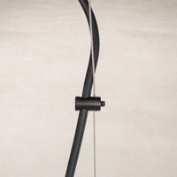 Jet black pendant light fixture with sleek wire and mounting details.