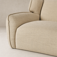 Allora Swivel Chair in Saxon Sand features soft, textured upholstery and rounded edges.