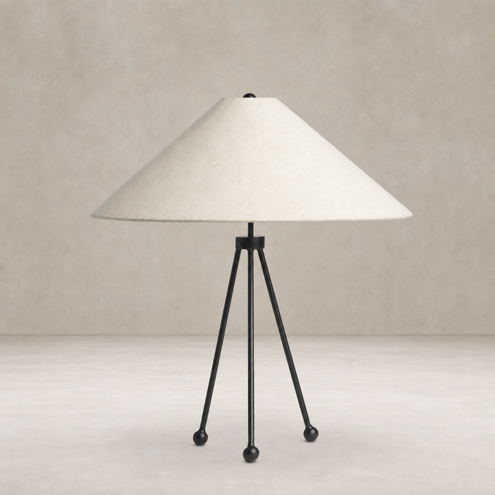 Matte black table lamp with a conical shade and tripod legs.