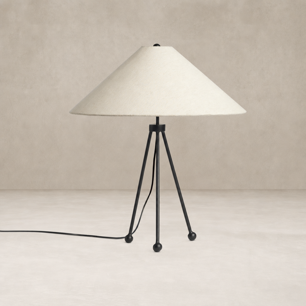 Matte black table lamp with a conical shade and tripod base design.