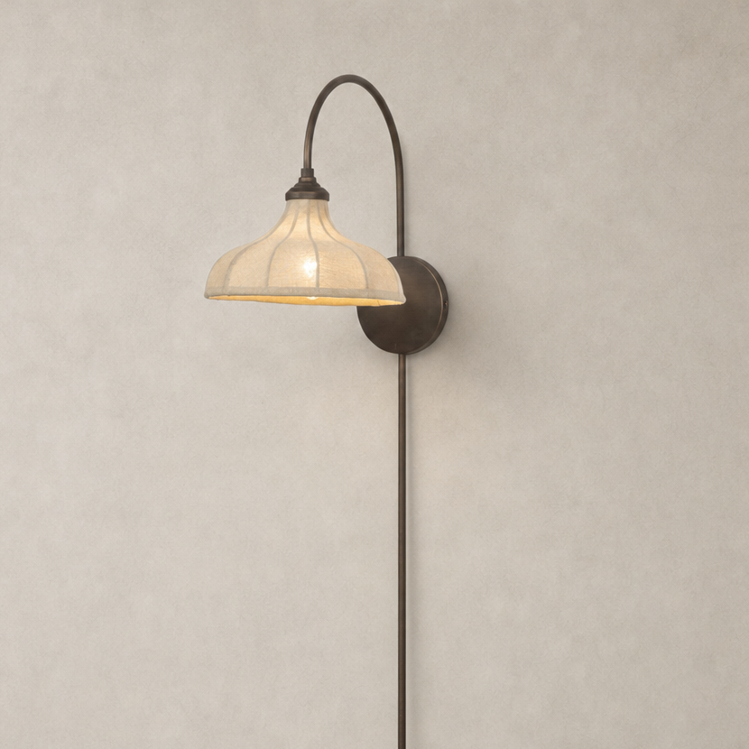 Waverly Sconce in light oil rubbed bronze with a curved arm and textured shade.