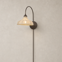 Waverly Sconce in light oil rubbed bronze with a curved arm and textured shade.