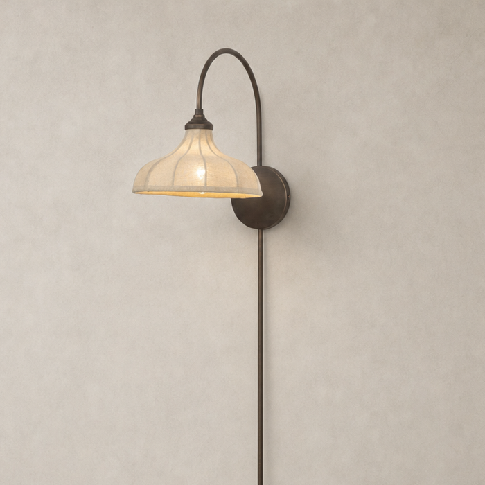 Waverly Sconce in light oil rubbed bronze with a curved arm and textured shade.