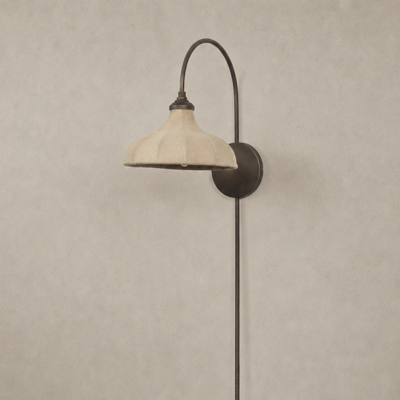 Waverly Sconce in light oil rubbed bronze with a curved arm and stylish linen shade.