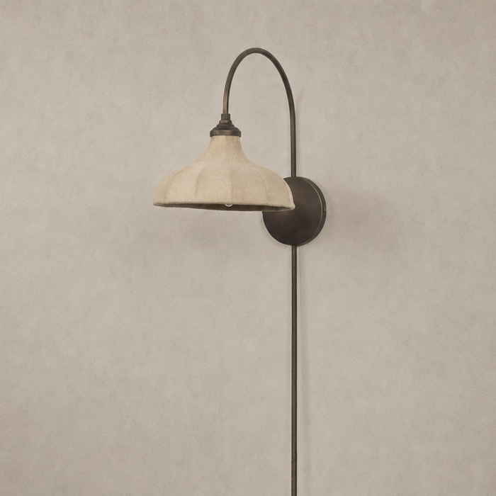 Waverly Sconce in light oil rubbed bronze with a curved arm and stylish linen shade.