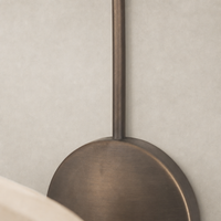 Waverly Sconce in light oil rubbed bronze with a sleek round design and smooth finish.