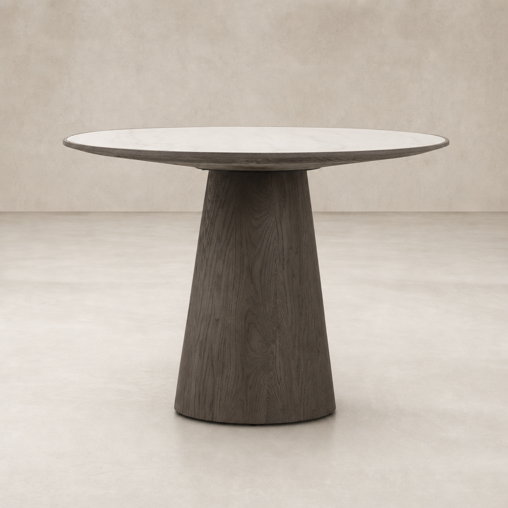 Romina Round Dining Table with a white marble top and unique dark wood base.
