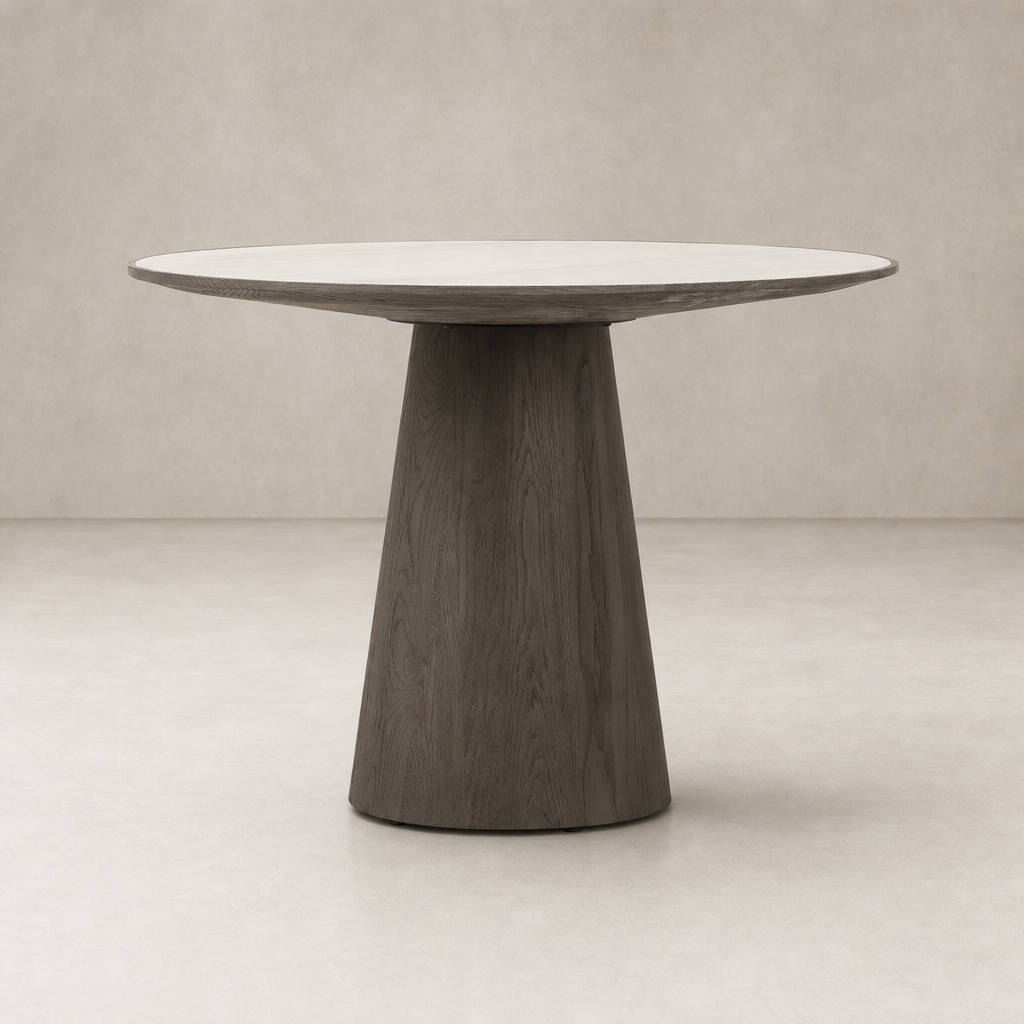 Romina Round Dining Table features a sleek white marble top and a modern dark wood base.