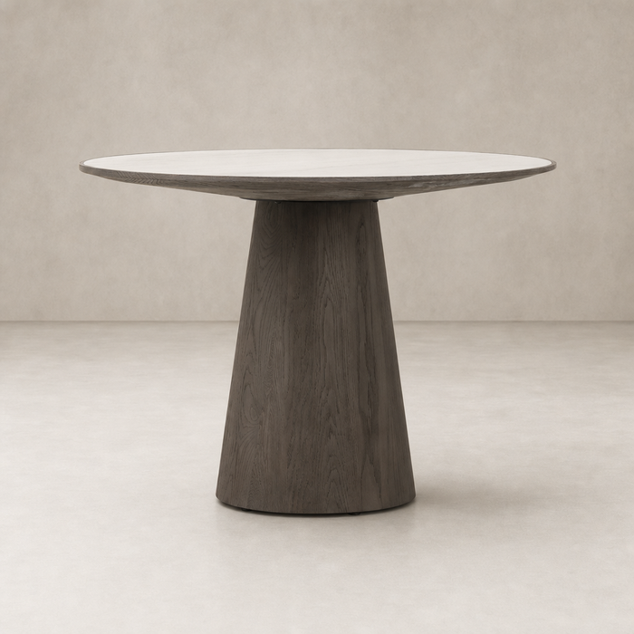 Romina Round Dining Table features a sleek white marble top and a modern dark wood base.